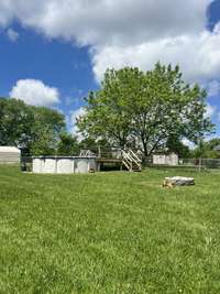Fenced in backyard with pool, firepit and horseshoe pit