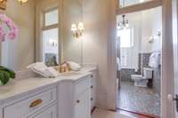 Renovate hall bathroom with period tile and custom vanity.