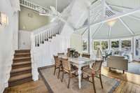 Wow! Look at this dramatic gazebo room. The fretwork and shell light fixture are beautiful and there is a back staircase that leads to the upstairs. The kitchen opens to this room and it is a nice place to relax and enjoy the sunny view.