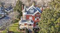 The home sits on. a large .40 acre lot graced with original iron fencing, carriage upping stone and hitching post. The sellers have spared no expense updating and preserving this fine home.