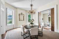 Huge dining room with pocket doors and amazing period light fixture. Nice window seats and built-in china cabinet.
