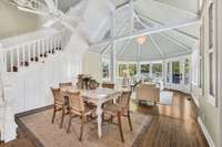 Here is another view of the gazebo room and the high planked ceiling. The door leads to a rear porch and the back yard.
