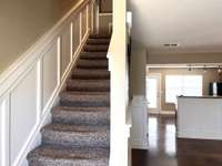 The wainscoting adds a sophisticated and elegant appearance to the home and is carried up through the staircase.
