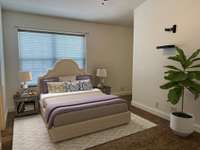 The second bedroom has ample space and recessed wall niches for desks and oversized dressers. (virtually staged)
