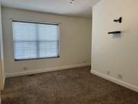 The second bedroom has ample space and recessed wall niches for desks and oversized dressers.