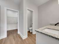 Primary Bathroom with water closet
