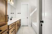Guest on-suite bath with extra storage and a walk in closet