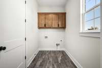 Laundry room with cabinet storage