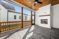 Covered and screened in porch with gas fireplace