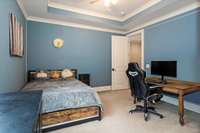 4BR features a tray ceiling, walk-in closet and ceiling light fan and shares a "jack-n-jill" bath with the 5BR
