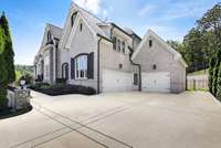 3 car garage features an expoxy floor + there's an additional parking pad