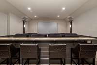 Family and friends will love movie night in this spectacular home theater; the illuminating bar countertop really sets the mood