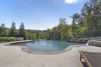 Plenty of room for lounging in the pool's sun-shelf or on the extensive sun deck