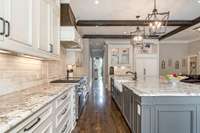 Another kitchen view depicting the abundance of cabinets and drawers