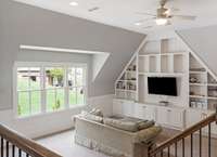 Large bonus room upstairs features a built-in entertaiment center complete with a mounted TV