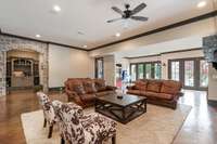 Wine enthusiasts are sure to love the wine room that is enhanced by gorgeous arched stone entry