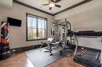 En-suite 6BR is currently used as an exercise room.  Mounted TV is included.