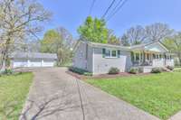 Left side yard and 3 car garage