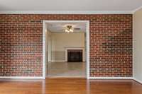 A view of the dining room with fireplace from the den, office, etc.