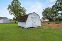 The storage building will remain with the home.