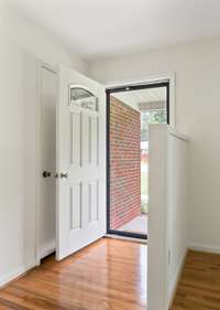 The front door leading into the home.  Those gleaming floors are awesome.
