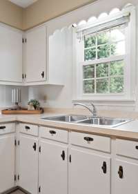 The kitchen sink overlooks the backyard.