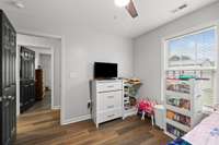 Overlooking the backyard, your 2nd bedroom is just across the hall from the Primary suite.