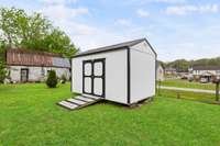 The shed is the perfect addition to store your mower, tools, and whatever else you want to stash away!