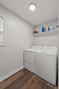 Your laundry room includes built in shelves on the opposite wall, perfect for additional storage and organizational solutions!