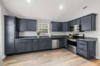 Such a smart layout with the laundry room just off your kitchen providing even more additional storage space for your large appliances, paper products and cleaning supplies!