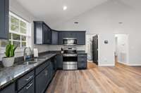 Marvel at your modern and gorgeous kitchen! The navy blue gives just the right touch of color while maintaining a neutral palette to add your personal decor.