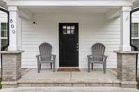 Coffee, tea, or something stronger? Enjoy your adorable covered front porch!