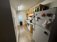 Kitchen. Cabinets were replaced 3 years ago. Refrigerator stays with house.