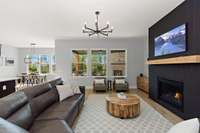 The windows in the great room are outfitted with electric custom drapery.