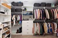 Custom closets provide ample storage for organization. One of two closets.