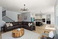 This space flows effortlessly into the kitchen and dining areas, ideal for entertaining or family time.