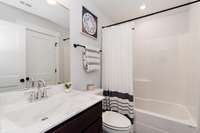 This bath is accessible from the 4th bedroom and also the hall.