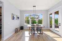 The adjacent dining area leads out to the show-stopping extended covered patio.