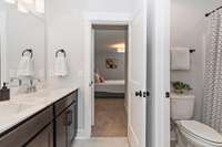 Jack-and-Jill bath connecting two bedrooms.
