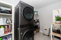 The laundry room is anything but ordinary-it has bee upgraded with stylish tile flooring and utility-friendly storage.