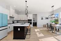 The kitchen itself is a chef’s dream—centered around gleaming quartz countertops and abundant cabinet space.