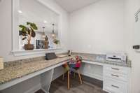 Office area off kitchen with built-in storage