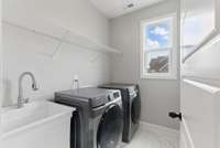 Large laudry room/mud room between garage and kitchen.