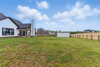 Large Newly Fenced Backyard with 18x25' steel storage shed.