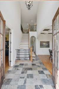 Expansive entry foyer. Private Office located to the left and a formal Dining Rm to the right.