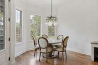 Eat-in Kitchen area with wonderful view of rear lawn and hardwood flooring. Also access to rear covered porch.