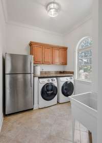 Conveniently located laundry room on 1st level with utility sink.