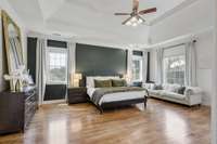 Now this is an Owner's Suite! Lots of natural light, hardwood flooring and a soaring ceiling.
