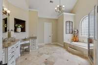 EnSuite has walk in shower plus a soaking tub with large private window for lots of natural light.