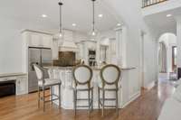 Kitchen with bartop seating area, open to the Great Rm